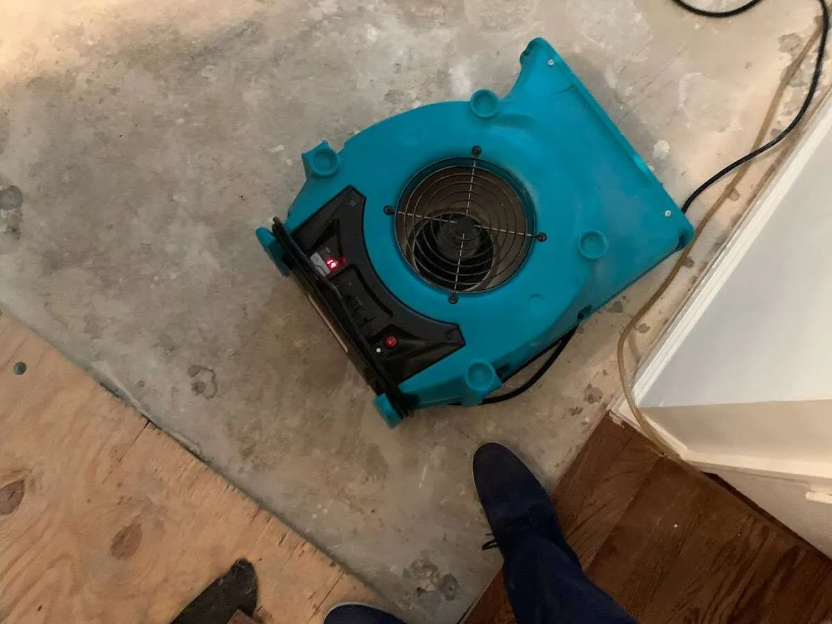 Air mover drying subfloor during Commercial Water Damage Restoration in Arroyo Grande